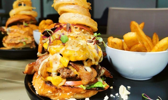 200g Gourmet Burgers with Rustic Fries and Onion Rings for 2