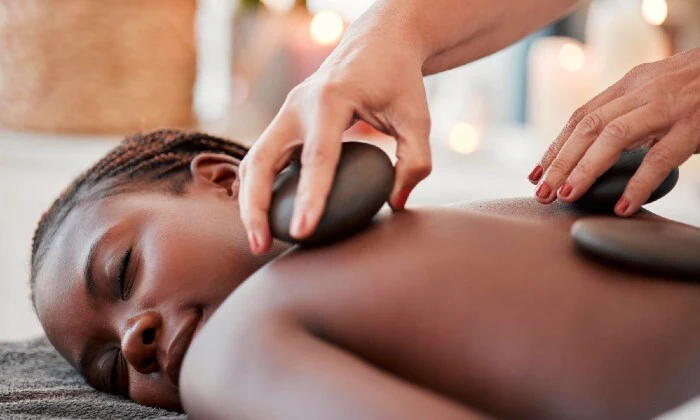 60-Minute Full Body Hot Stone Massage with Optional Facial at The Royal MO Spa
