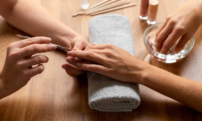 Deluxe or Executive Manicure and/or Pedicure at DD's Day Spa & Hair